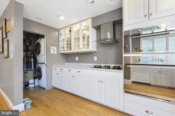 Interior, Kitchen, Recessed Lighting, Washer, Wood Texture Flooring