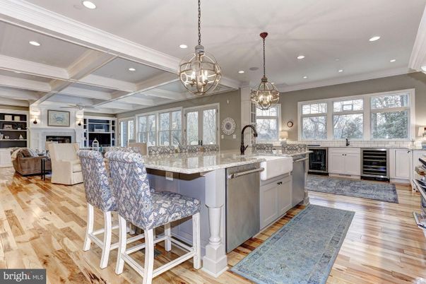 Chandelier, Interior, Kitchen, Living room, Pendant Lights, Recessed Lighting, Stainless Steel Appliances, Wood Texture Flooring