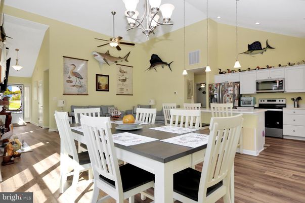 Chandelier, Dining room, Interior, Kitchen, Pendant Lights, Recessed Lighting, Stainless Steel Appliances, Wood Texture Flooring