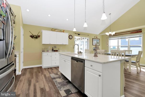 Chandelier, Dining room, Interior, Kitchen, Pendant Lights, Recessed Lighting, Stainless Steel Appliances, Wood Texture Flooring