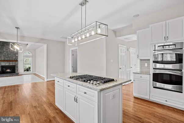 Fireplace, Interior, Kitchen, Pendant Lights, Stainless Steel Appliances, Wood Texture Flooring