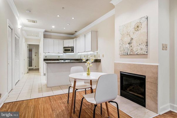 Dining room, Fireplace, Interior, Kitchen, Recessed Lighting, Stainless Steel Appliances, Wood Texture Flooring