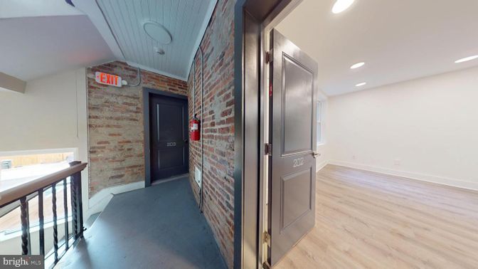 Elevator, Interior, Recessed Lighting, Stone Walls, Wood Texture Flooring