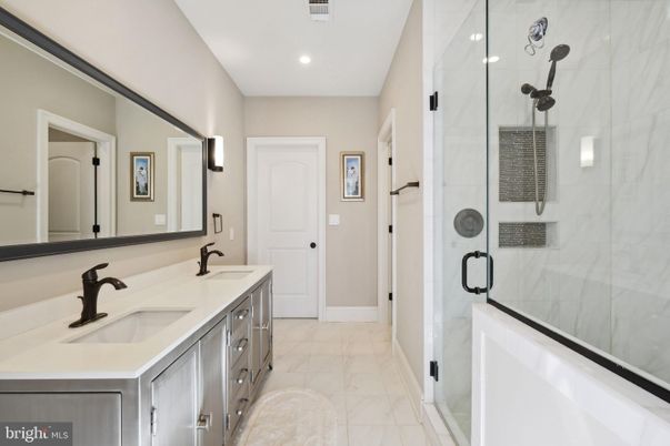 Bathroom, Dual Sink Vanities, Glass Shower, Interior, Marble, Marble Walls, Recessed Lighting