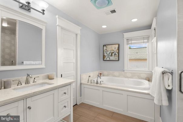 Bathroom, Dual Sink Vanities, Interior, Recessed Lighting, Wood Texture Flooring