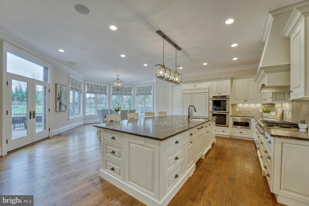 Chandelier, Dining room, Interior, Kitchen, Pendant Lights, Recessed Lighting, Stainless Steel Appliances, Wood Texture Flooring