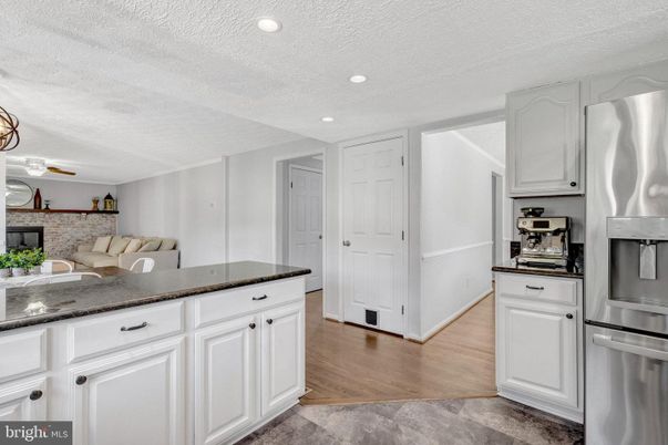 Interior, Kitchen, Recessed Lighting, Stainless Steel Appliances, Stone Walls, Wood Texture Flooring