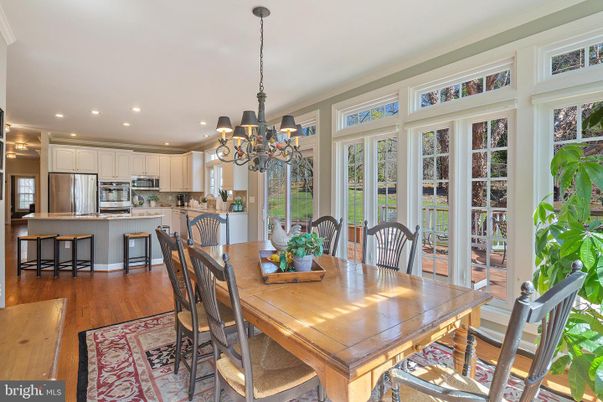 Chandelier, Dining room, Interior, Kitchen, Recessed Lighting, Stainless Steel Appliances, Wood Texture Flooring