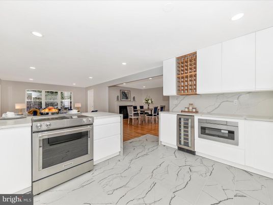 Dining room, Interior, Kitchen, Marble, Marble Walls, Recessed Lighting, Stainless Steel Appliances, Wood Texture Flooring