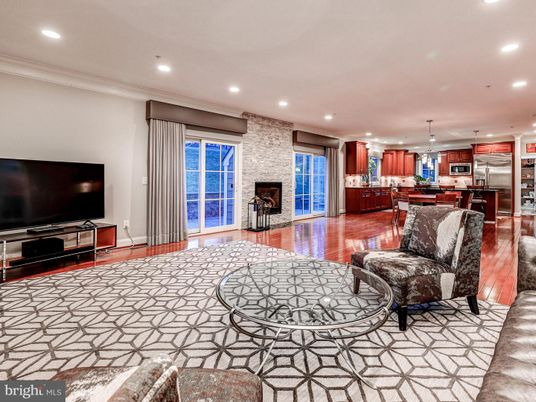 Fireplace, Interior, Kitchen, Living room, Pendant Lights, Recessed Lighting, Stainless Steel Appliances, Stone Walls, Wood Texture Flooring