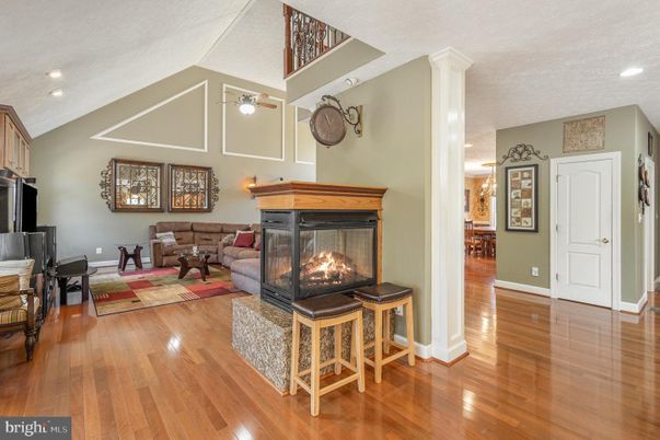 Dining room, Fireplace, Interior, Living room, Recessed Lighting, Wood Texture Flooring