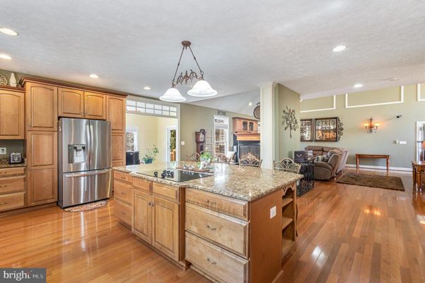 Fireplace, Interior, Kitchen, Living room, Pendant Lights, Recessed Lighting, Stainless Steel Appliances, Wood Texture Flooring