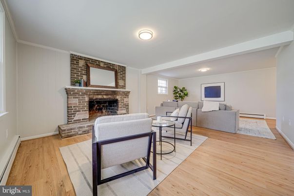 Fireplace, Interior, Living room, Recessed Lighting, Stone Walls, Wood Texture Flooring