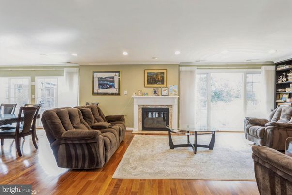 Dining room, Fireplace, Interior, Living room, Recessed Lighting, Wood Texture Flooring