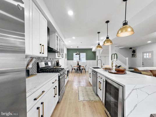 Dining room, Interior, Kitchen, Pendant Lights, Recessed Lighting, Stainless Steel Appliances, Wood Texture Flooring