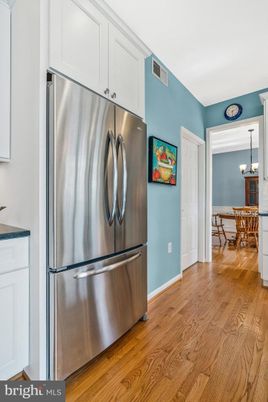 Chandelier, Dining room, Interior, Kitchen, Pendant Lights, Stainless Steel Appliances, Wood Texture Flooring