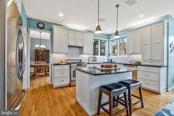 Chandelier, Dining room, Interior, Kitchen, Pendant Lights, Recessed Lighting, Stainless Steel Appliances, Wood Texture Flooring