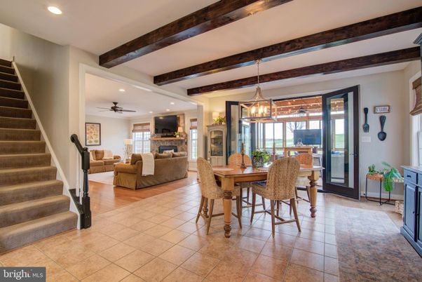 Dining room, Fireplace, Interior, Living room, Pendant Lights, Recessed Lighting, Wooden Beams, Wood Texture Flooring