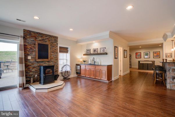 Fireplace, Interior, Pendant Lights, Recessed Lighting, Stone Walls, Wood Texture Flooring