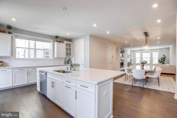 Chandelier, Dining room, Interior, Kitchen, Pendant Lights, Recessed Lighting, Stainless Steel Appliances, Wood Texture Flooring