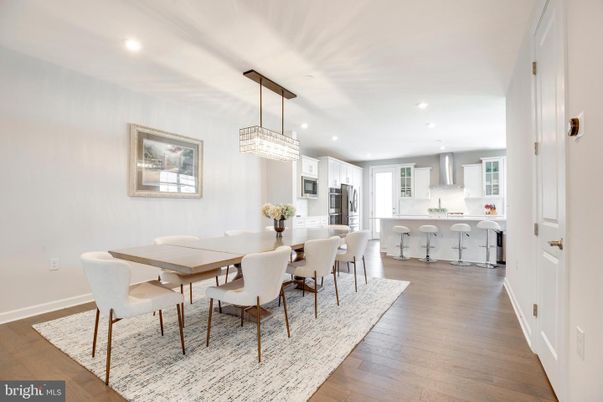 Chandelier, Dining room, Interior, Kitchen, Pendant Lights, Recessed Lighting, Stainless Steel Appliances, Wood Texture Flooring