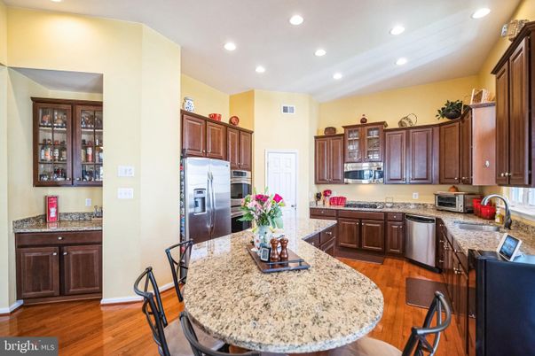 Dining room, Interior, Kitchen, Recessed Lighting, Stainless Steel Appliances, Wood Texture Flooring