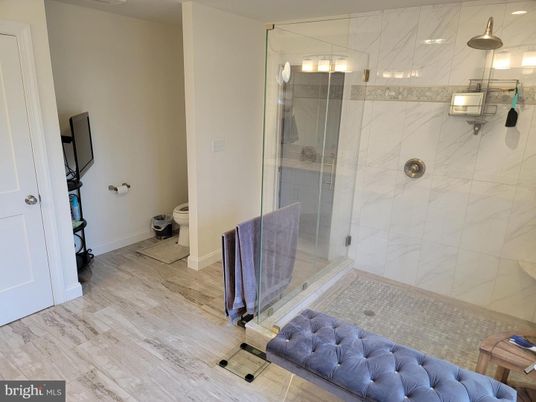 Bathroom, Glass Shower, Interior, Marble Walls, Wood Texture Flooring