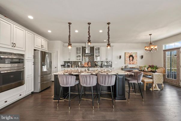 Chandelier, Dining room, Interior, Kitchen, Pendant Lights, Recessed Lighting, Stainless Steel Appliances, Wood Texture Flooring
