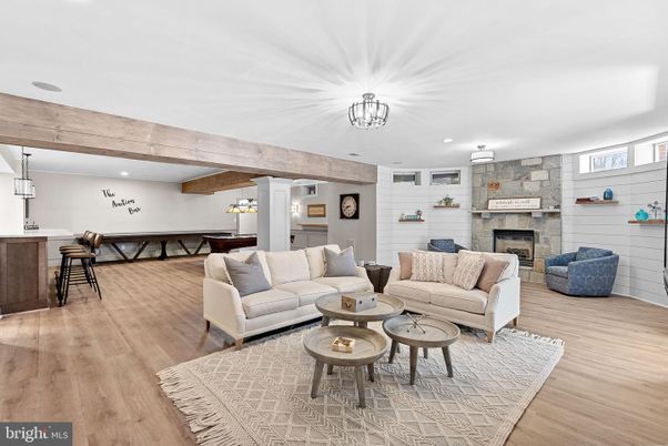 Fireplace, Interior, Living room, Pendant Lights, Recessed Lighting, Stone Walls, Wooden Beams, Wood Texture Flooring