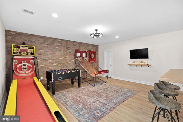 Game Room, Interior, Recessed Lighting, Stone Walls, Wood Texture Flooring