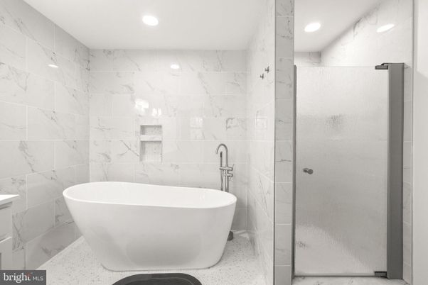 Bathroom, Free Standing Baths, Glass Shower, Interior, Marble Walls, Recessed Lighting