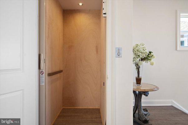 Elevator, Interior, Recessed Lighting, Wood Texture Flooring, Wooden Walls