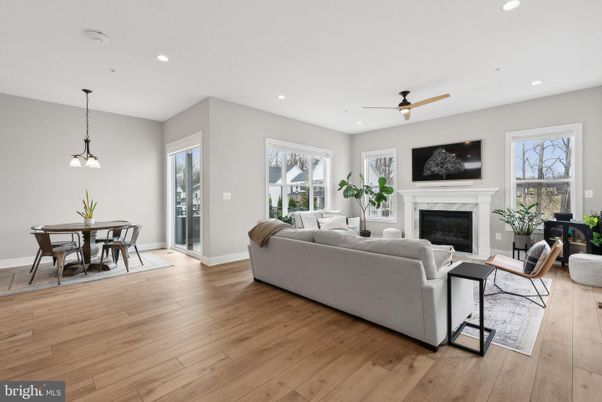 Dining room, Fireplace, Interior, Living room, Pendant Lights, Recessed Lighting, Wood Texture Flooring