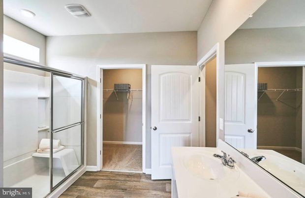 Bathroom, Dual Sink Vanities, Glass Shower, Interior, Recessed Lighting, Walk-in Closets, Wood Texture Flooring
