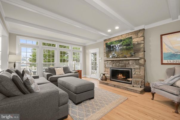 Fireplace, Interior, Living room, Recessed Lighting, Stone Walls, Wood Texture Flooring
