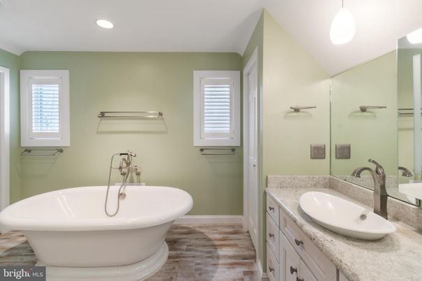 Bathroom, Dual Sink Vanities, Free Standing Baths, Interior, Recessed Lighting, Wood Texture Flooring