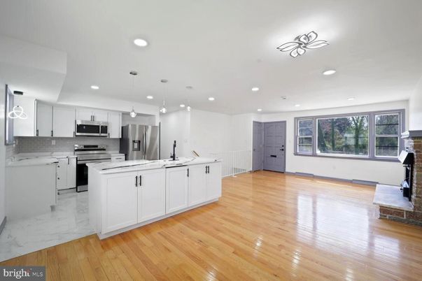 Interior, Kitchen, Marble, Pendant Lights, Recessed Lighting, Stainless Steel Appliances, Wood Texture Flooring