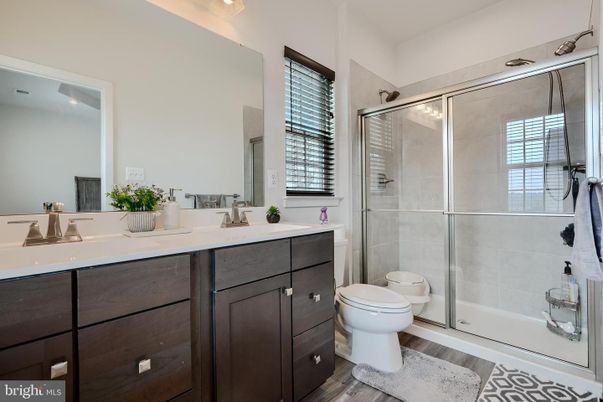Bathroom, Dual Sink Vanities, Glass Shower, Interior, Wood Texture Flooring