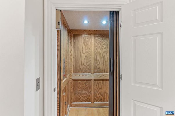 Elevator, Interior, Recessed Lighting, Wood Texture Flooring, Wooden Walls