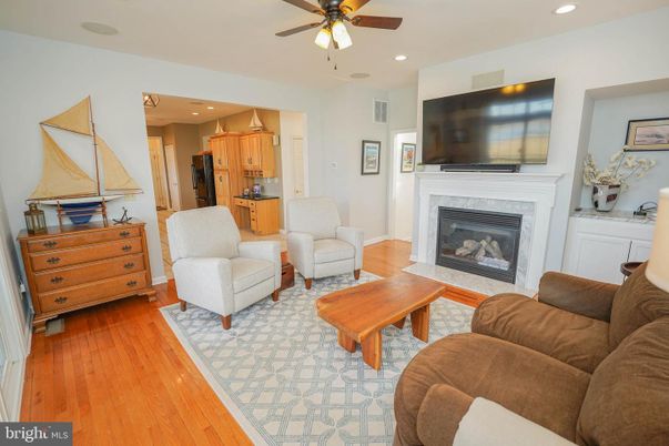Fireplace, Interior, Kitchen, Living room, Recessed Lighting, Wood Texture Flooring