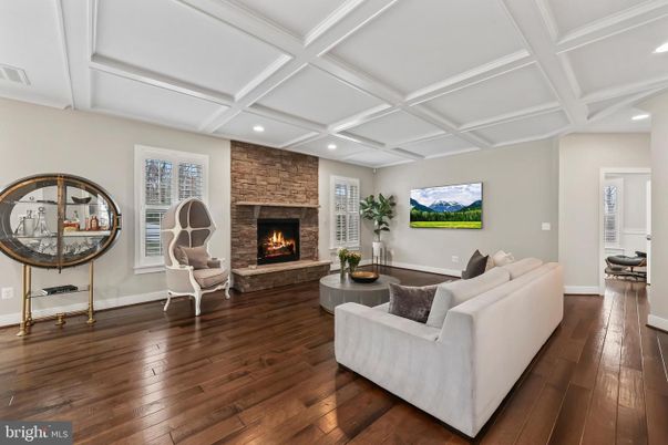 Fireplace, Interior, Living room, Recessed Lighting, Stone Walls, Wood Texture Flooring