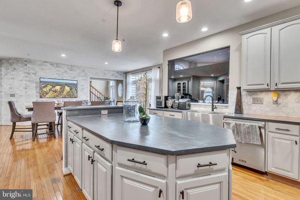 Dining room, Interior, Kitchen, Pendant Lights, Recessed Lighting, Stainless Steel Appliances, Stone Walls, Wood Texture Flooring