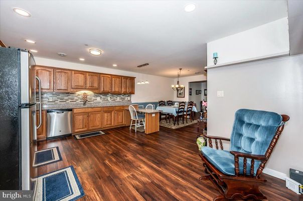 Chandelier, Dining room, Interior, Kitchen, Pendant Lights, Recessed Lighting, Stainless Steel Appliances, Wood Texture Flooring