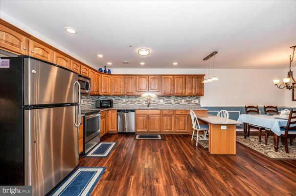 Dining room, Interior, Kitchen, Pendant Lights, Recessed Lighting, Stainless Steel Appliances, Wood Texture Flooring