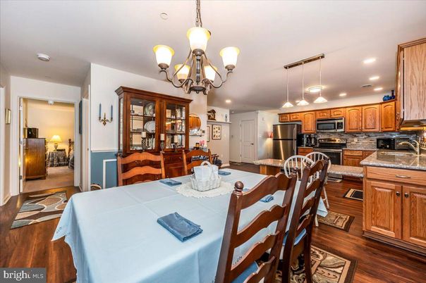 Chandelier, Dining room, Interior, Kitchen, Pendant Lights, Recessed Lighting, Stainless Steel Appliances, Wood Texture Flooring