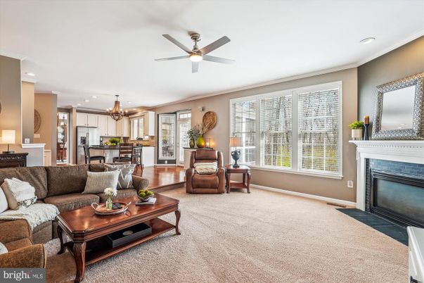 Chandelier, Fireplace, Interior, Kitchen, Living room, Recessed Lighting, Stainless Steel Appliances, Wood Texture Flooring