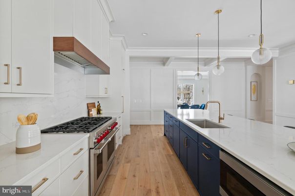 Interior, Kitchen, Marble Walls, Pendant Lights, Recessed Lighting, Stainless Steel Appliances, Wood Texture Flooring