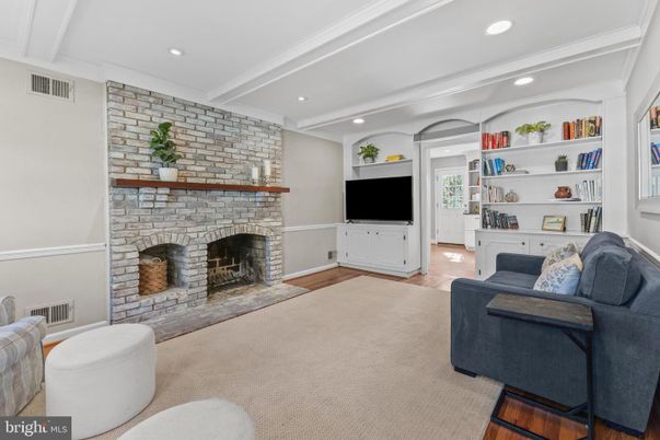 Fireplace, Interior, Living room, Recessed Lighting, Stone Walls, Wood Texture Flooring