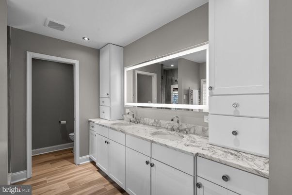 Bathroom, Dual Sink Vanities, Interior, Recessed Lighting, Wood Texture Flooring