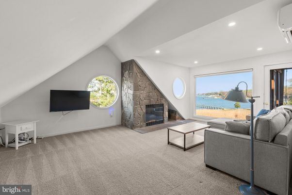 Fireplace, Interior, Living room, Recessed Lighting, Stone Walls, Water